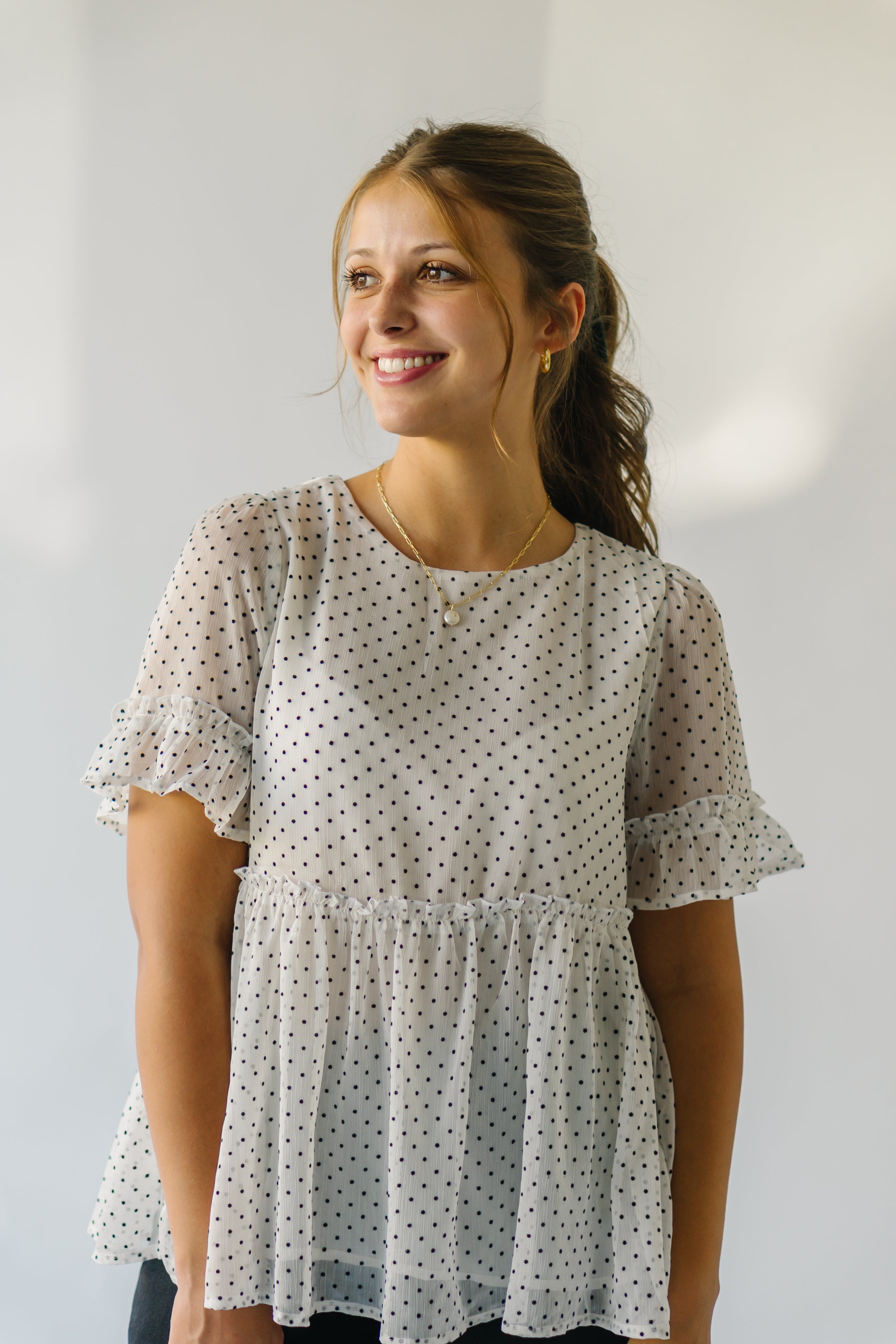 The Duran Polka Dot Peplum in Ivory