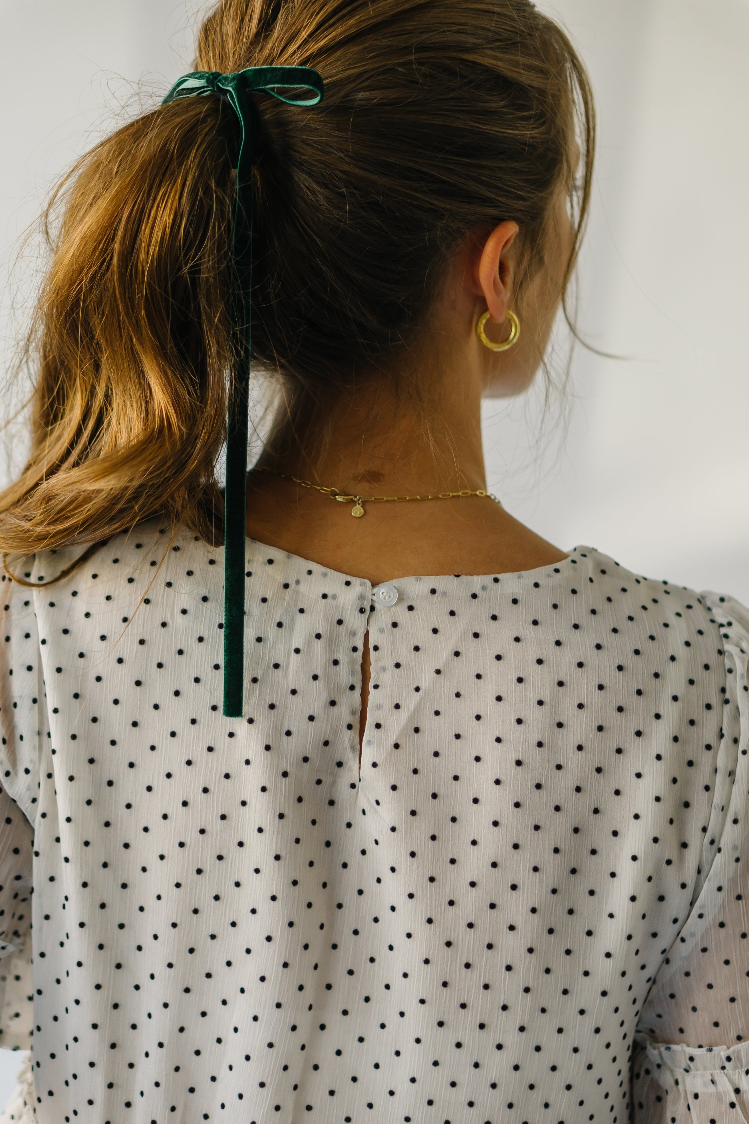 The Duran Polka Dot Peplum in Ivory